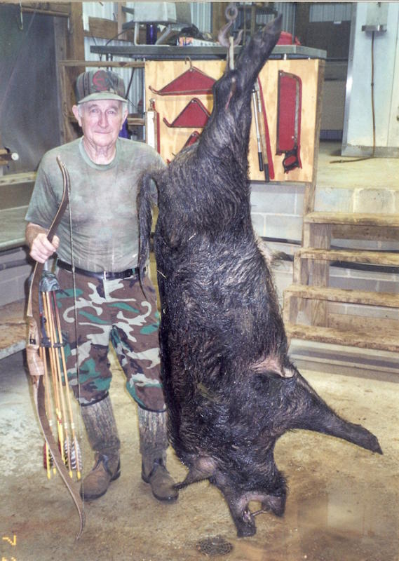 Owen Jeffery with a massive South Carolina hog he took with a bare bow.