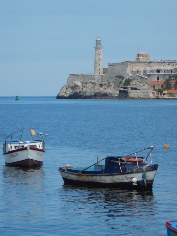 Havana is a city steeped in tradition, as is its harbor. The Castillo de los Tres Reyes del Morro stands watch over Havana Harbor and two of her boats.