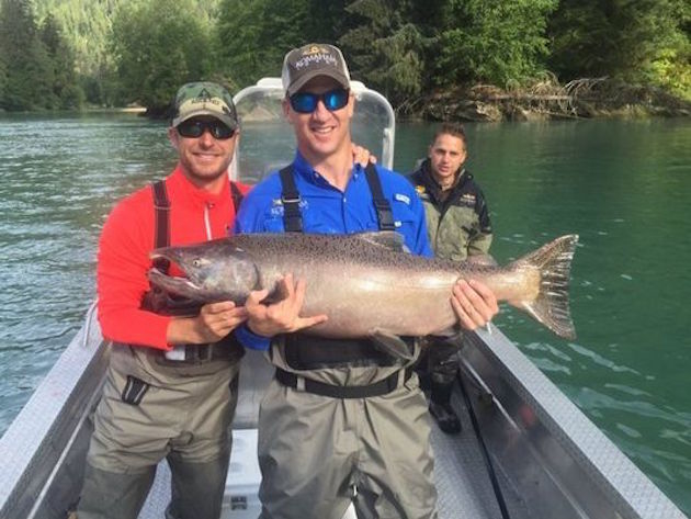 Dierks Bentley, right, posted this photo of Peyton Manning's king salmon catch on social media. (Photo: Twitter)