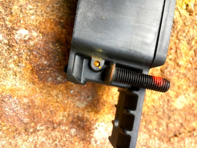 The edge of the Mossberg's bedding screw and a pin holding the magazine detach spring represent the bulk of the rust Alaska inflicted on the Patriot. 