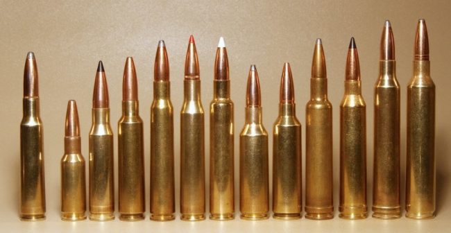 Here are some of the world's 7mm centerfires. Far left is the original 7x57mm Mauser. Third from L. is 7mm-08 Rem., then .284 Win. followed by the long, skinny 7x64 Brenneke and .280 Remington (red tip.) The .280 Ackley Improved (white tip) is beside the other two fading short-action 7mms, the SAUM and WSM. Then comes the 7mm Wby. Mag., Rem. Mag. STW and RUM. "Little stubby" on the left is a 7mm BR.
