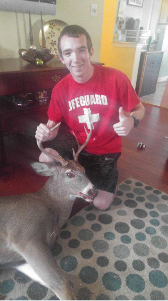 Ryan Manchester and his first-ever whitetail buck.