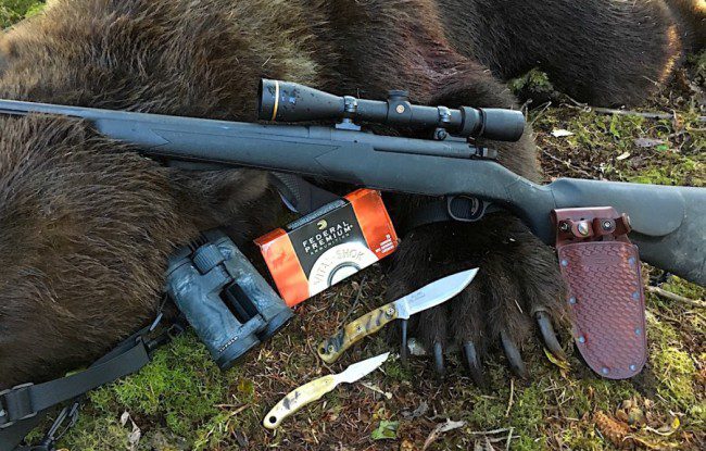 Master Guide Charles Allen whipped out his personal Diamond Blade knives to skin Tom's bear.