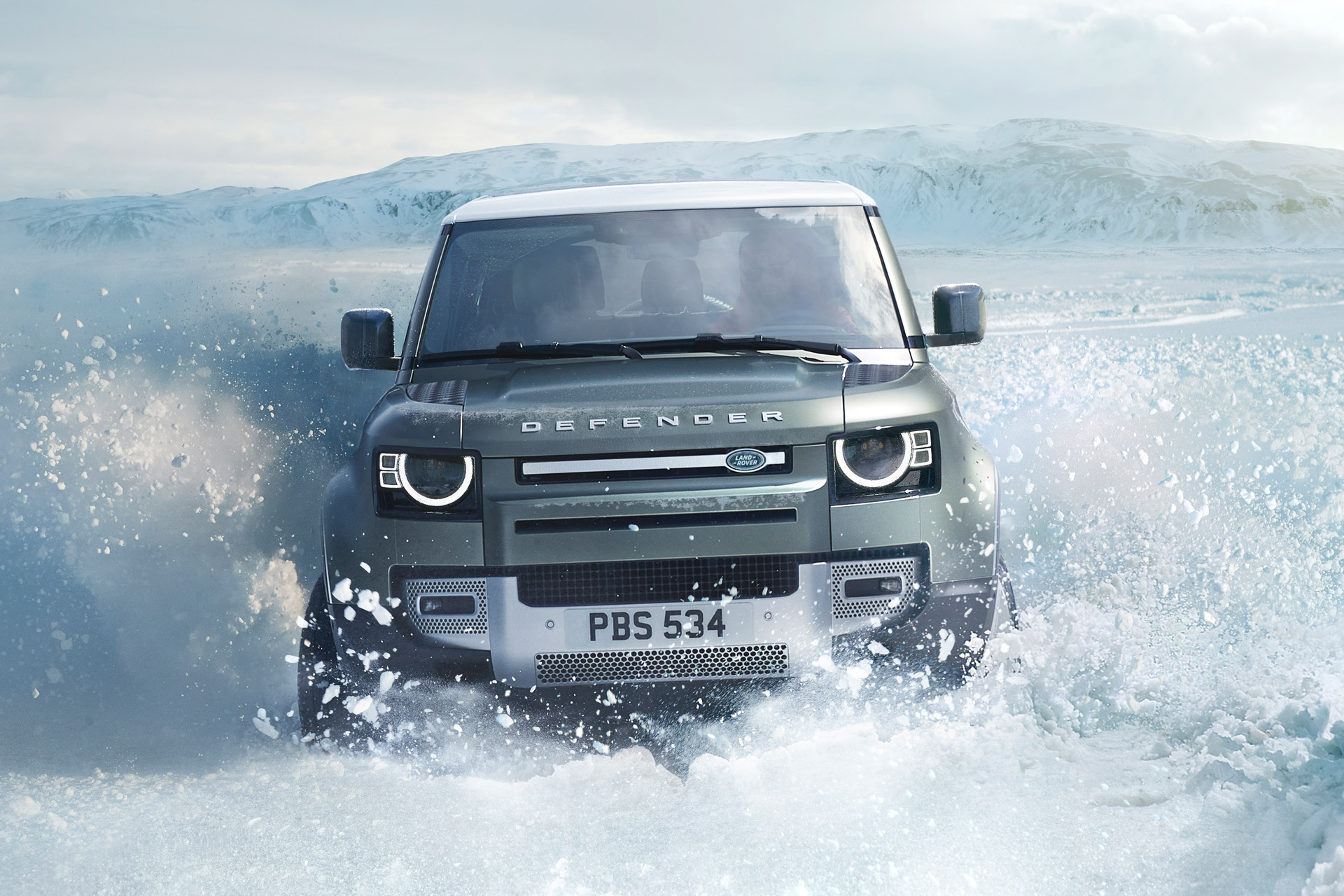 land rover defender in snow