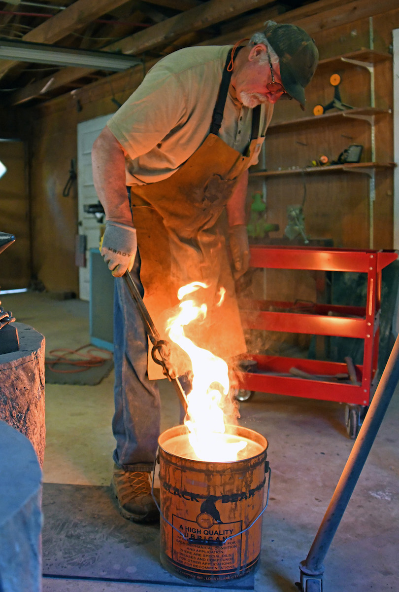 blacksmith quenching blade