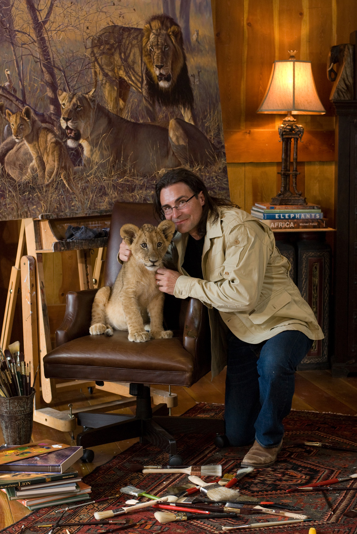 John Banovich with lion cub