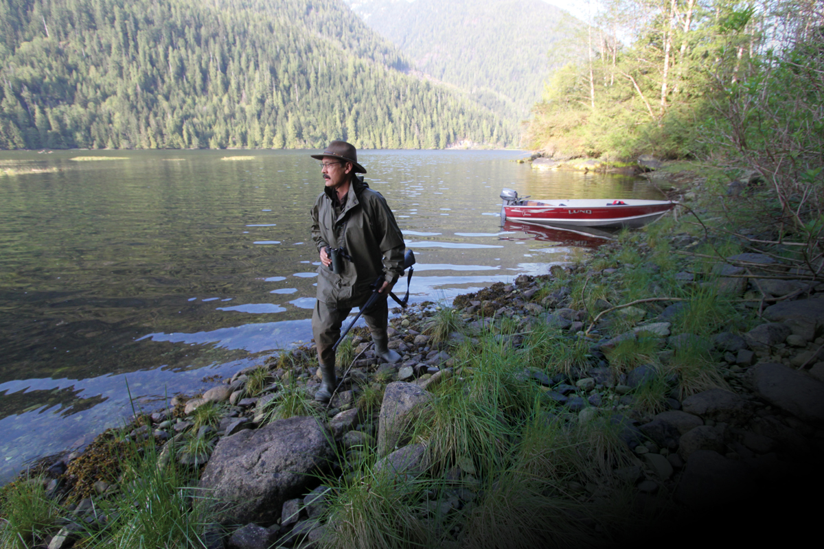 hunter walking along shore