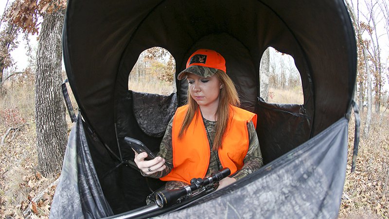 female hunter using app