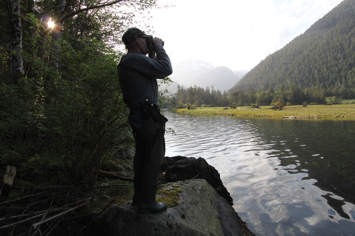 hunter looking through binoculars