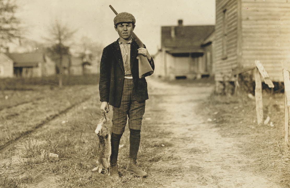 old photo boy with rabbit