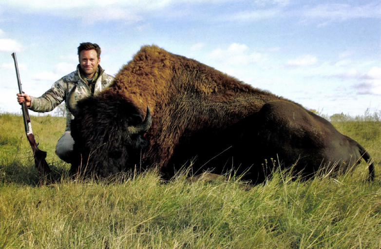 hunter with bison buffalo kill