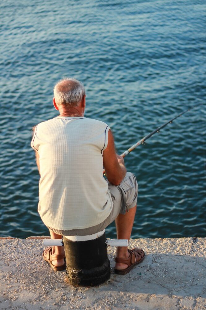 old man fishing on dock