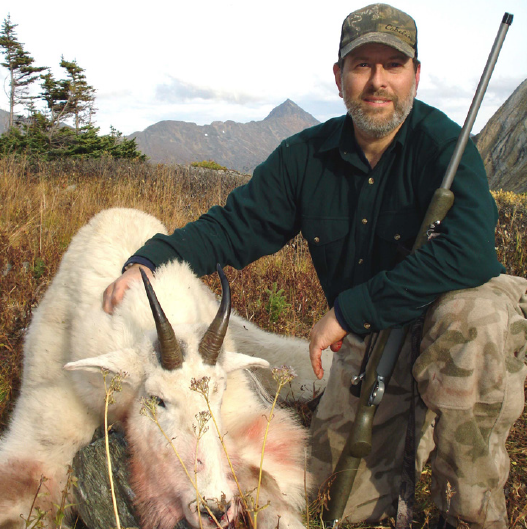 hunter and mountain goat