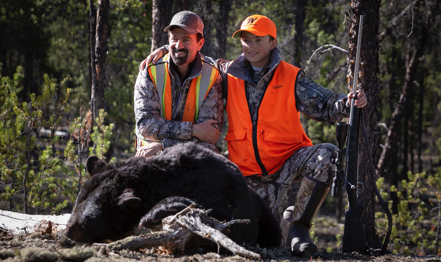 Dorsey and son with bear