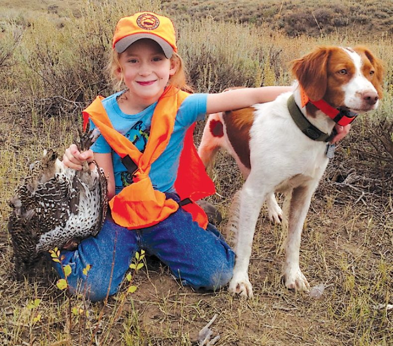 young hunter with sharptails