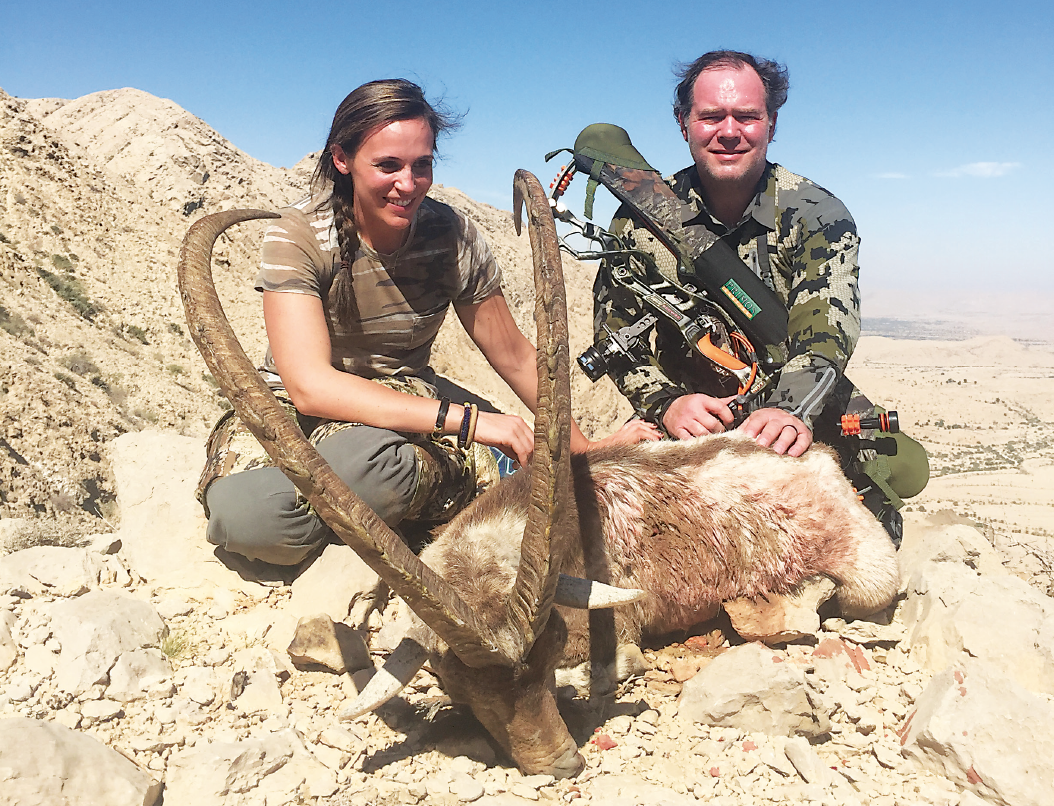 hunters with ibex