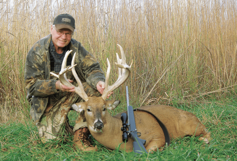 hunter with buck deer
