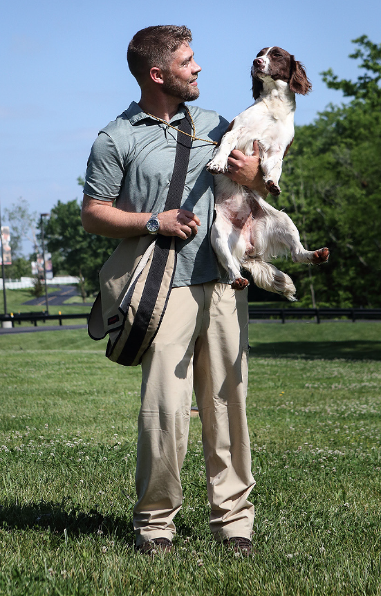 trainer with spaniel dog