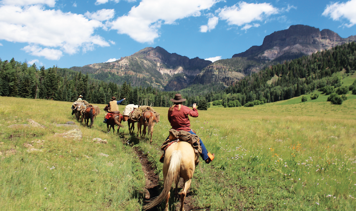 horseback hunters in Colorado mountains